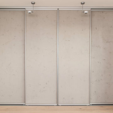 Schiebetürenschrank in Betonoptik