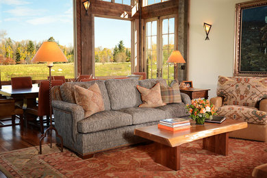 Example of a mid-sized mountain style open concept dark wood floor living room design in Other with a standard fireplace and a stone fireplace