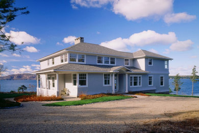 Inspiration for a large transitional gray two-story wood house exterior remodel in Portland Maine with a hip roof and a shingle roof