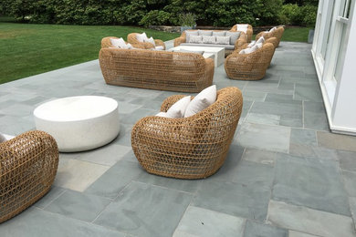 Patio kitchen - large modern backyard concrete patio kitchen idea in New York with no cover