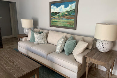 Example of a mid-sized transitional enclosed family room design in Tampa