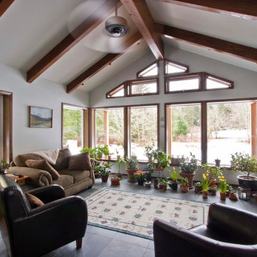 Expansive sunroom addition that added much needed natural light to this home in