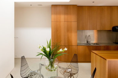 Photo of a modern open plan dining in Sydney with concrete floors.