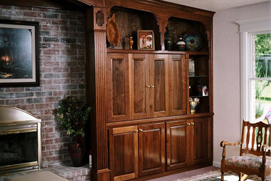 Example of a mid-sized open concept carpeted family room design in Other with white walls, a standard fireplace, a brick fireplace and no tv