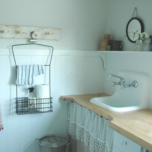 Inspiration for a romantic utility room in Other with a built-in sink, wood worktops and beige worktops.