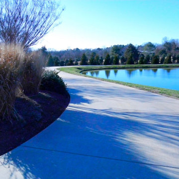 Asian InspiredDriveway wraps around the pond