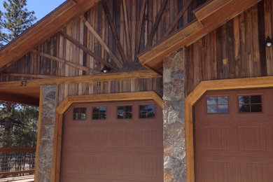 Inspiration for a large rustic detached two-car garage remodel in Albuquerque