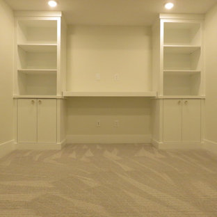 This is an example of a medium sized classic look-out basement in Calgary with white walls, carpet and grey floors.