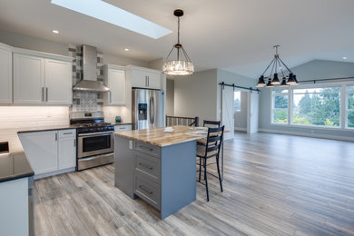 Eat-in kitchen - mid-sized contemporary u-shaped eat-in kitchen idea in Other