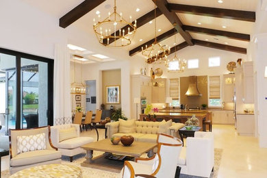 Example of a large transitional open concept travertine floor and brown floor family room design in Miami with beige walls, no fireplace and a wall-mounted tv