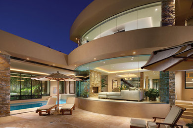 This is an example of a large contemporary patio in Orange County with no cover.
