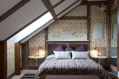 Bedroom - cottage light wood floor bedroom idea in Other with multicolored walls