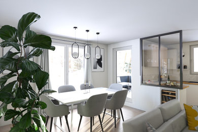 Inspiration pour une salle à manger ouverte sur le salon design de taille moyenne avec un mur beige, sol en stratifié, aucune cheminée et un sol gris.