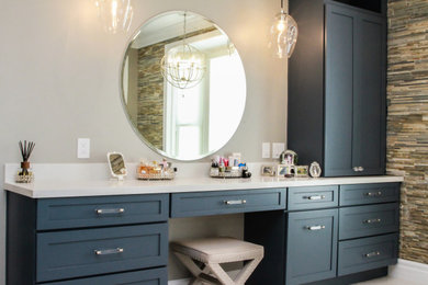 Photo of a large beach style master bathroom in Los Angeles with blue cabinets, a freestanding tub, an alcove shower, a one-piece toilet, white tile, beige walls, a drop-in sink, engineered quartz benchtops, yellow floor, an open shower, white benchtops, a shower seat, a single vanity, a built-in vanity and planked wall panelling.
