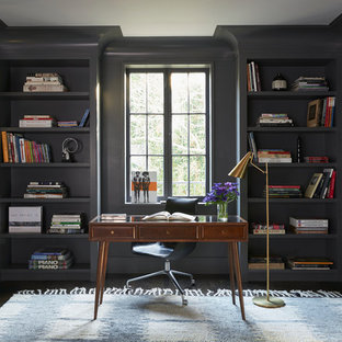 This is an example of a transitional study room in Los Angeles with grey walls, cork floors and a freestanding desk.
