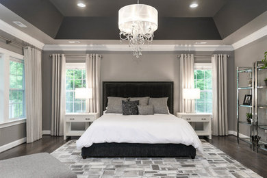 Example of a large transitional master dark wood floor and brown floor bedroom design in DC Metro with beige walls and no fireplace