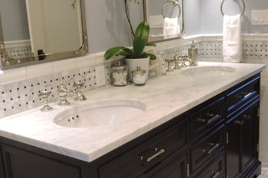 Bathroom - mid-sized coastal master white tile and subway tile bathroom idea in Santa Barbara with an undermount sink, furniture-like cabinets, black cabinets and marble countertops