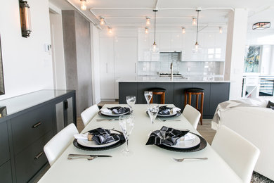 Example of a minimalist dining room design in Vancouver