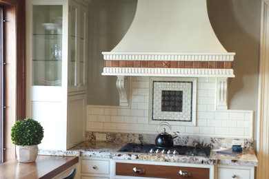 Eat-in kitchen - mid-sized craftsman l-shaped medium tone wood floor eat-in kitchen idea in Louisville with an undermount sink, beaded inset cabinets, light wood cabinets, granite countertops, white backsplash, subway tile backsplash, paneled appliances and an island