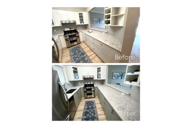 Kitchen - coastal u-shaped kitchen idea in Other with flat-panel cabinets and blue cabinets