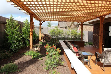 Inspiration for a small contemporary backyard concrete patio remodel in Austin with a pergola