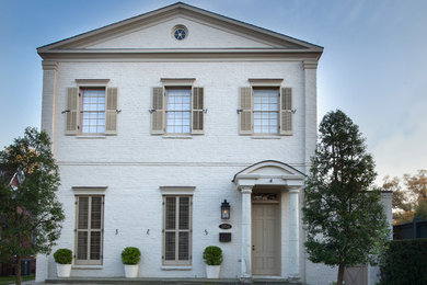This is an example of a traditional two-storey brick white exterior in New Orleans.