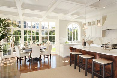 Inspiration for a large contemporary dark wood floor kitchen/dining room combo remodel in San Francisco with white walls and no fireplace