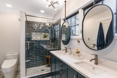 Example of a small transitional master blue tile and ceramic tile ceramic tile, multicolored floor and double-sink bathroom design in Other with shaker cabinets, blue cabinets, a bidet, white walls, an undermount sink, quartz countertops, a hinged shower door, white countertops and a built-in vanity