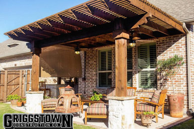 Example of a mid-sized trendy backyard concrete patio design in Other