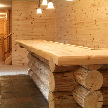 Knotty pine and full log with saddle notch corners bar