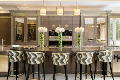 Design ideas for a large traditional single-wall kitchen in London with grey cabinets, quartz worktops, ceramic flooring, an island, beige floors, grey worktops, flat-panel cabinets, stainless steel appliances and a submerged sink.