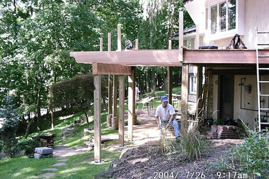 Example of an arts and crafts deck design in Other