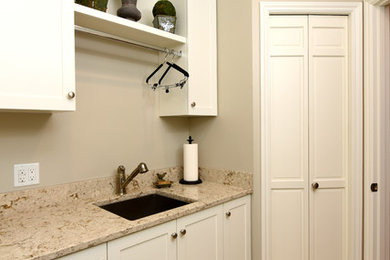Inspiration for a traditional laundry room in Seattle with shaker cabinets and white cabinets.