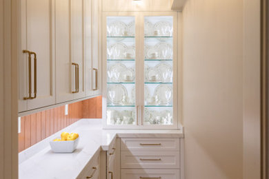 Kitchen - mid-sized transitional medium tone wood floor kitchen idea in Other with shaker cabinets, quartz countertops and white countertops