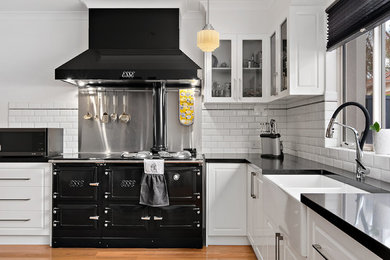 Modern kitchen in Perth with solid surface benchtops and no island.