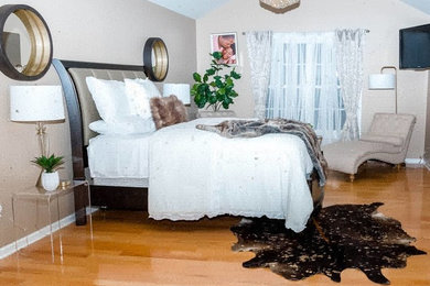 Example of a large minimalist master bedroom design in Philadelphia with beige walls