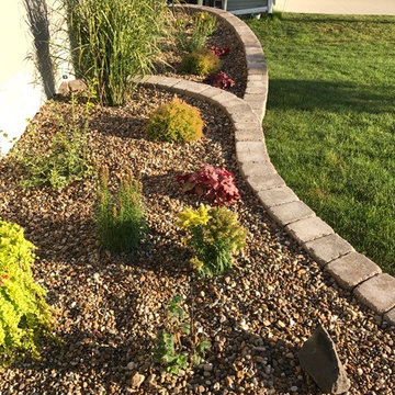 Front yard landscape garden bed with retaining wall block