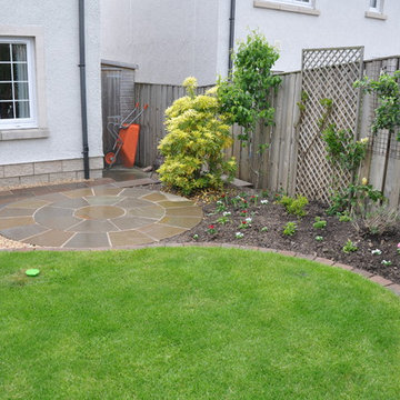 Shaped lawn edged with tegula blocks
