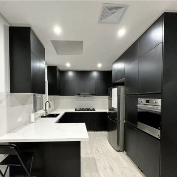 Full View of Matte Black Handleless U-Shaped Functional Kitchen