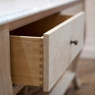 Large eclectic kitchen pantry ideas - Example of a large eclectic u-shaped dark wood floor kitchen pantry design in Dublin with a single-bowl sink, beaded inset cabinets, white cabinets, marble countertops, white backsplash, stone slab backsplash, stainless steel appliances and an island