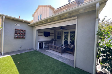 Patio - large contemporary backyard concrete paver patio idea in Orange County