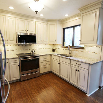 Cream Painted Waypoint Cabinets with Granite Countertops
