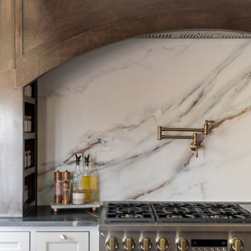 Painted Inset Cabinetry and Leathered Granite in a Transitional Edmond Kitchen