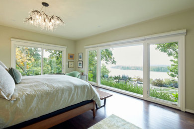 Inspiration for a large timeless master dark wood floor and brown floor bedroom remodel in Portland with green walls