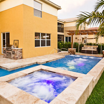 Roman/Geometric Pool With Pergola, Laminar Deck Jets and Spa in Boynton Beach