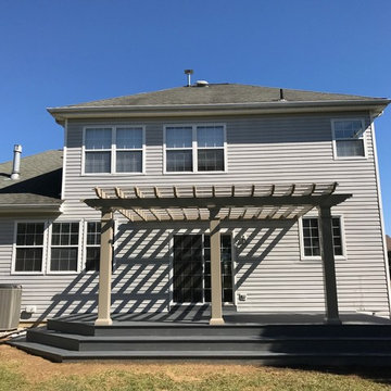Backyard Deck With Corner-Wrapped Steps and Pergola