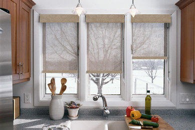 Mid-sized trendy single-wall enclosed kitchen photo in Phoenix with a double-bowl sink, shaker cabinets, light wood cabinets, granite countertops, stainless steel appliances and window backsplash