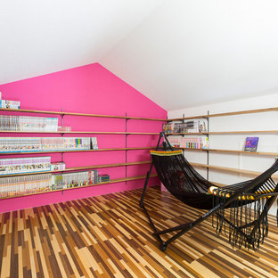 This is an example of a modern home office and library in Other.