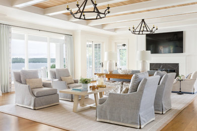 Living room - mid-sized coastal open concept light wood floor, shiplap ceiling and wall paneling living room idea in Milwaukee with white walls, a standard fireplace, a stone fireplace and a wall-mounted tv