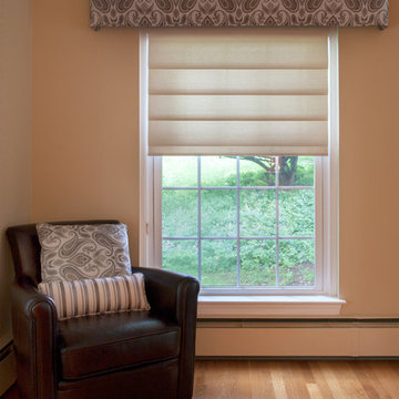 Living Room with Custom Cornice, Custom Throw pillows and Modern Roman Shades